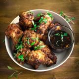 Chicken Wings on the grill  with honey & garlic sauce